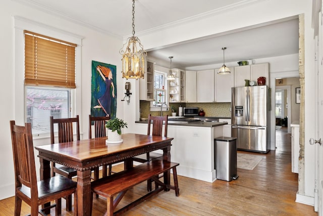 3617 Meadowbrook Ave, Nashville, TN 37205 - dining area with an inviting chandelier, ornamental molding, and light wood-type flooring
