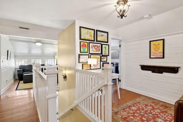 3617 Meadowbrook Ave, Nashville, TN 37205 - stairway featuring brick wall, visible vents, vaulted ceiling, wood finished floors, and baseboards
