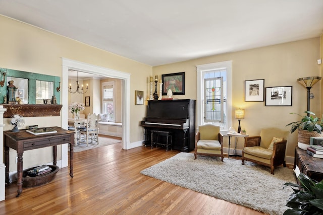 3617 Meadowbrook Ave, Nashville, TN 37205 - living area with wood finished floors, baseboards, a chandelier, and a wealth of natural light