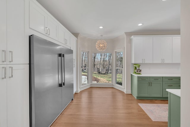 1237 Temple Ridge Dr, Nashville, TN 37221 - kitchen featuring white cabinets, light countertops, green cabinetry, light wood-type flooring, and built in fridge