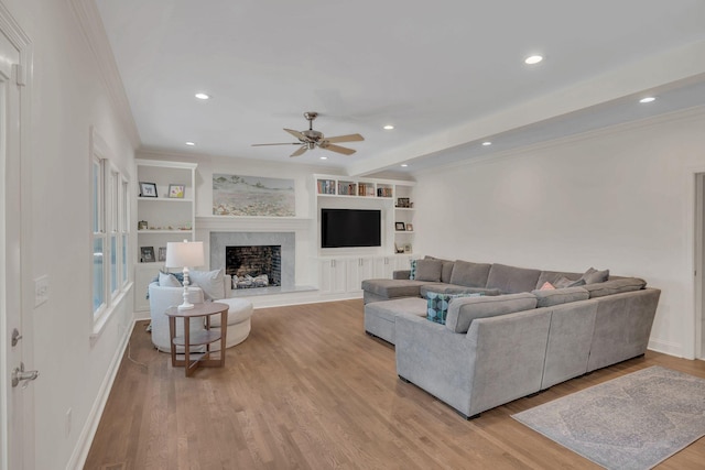 1237 Temple Ridge Dr, Nashville, TN 37221 - living area with ornamental molding, wood finished floors, a premium fireplace, ceiling fan, and recessed lighting
