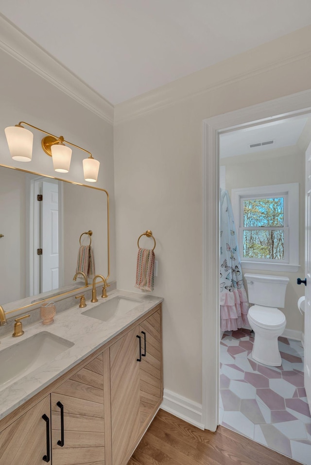 1237 Temple Ridge Dr, Nashville, TN 37221 - full bathroom with double vanity, crown molding, toilet, and a sink