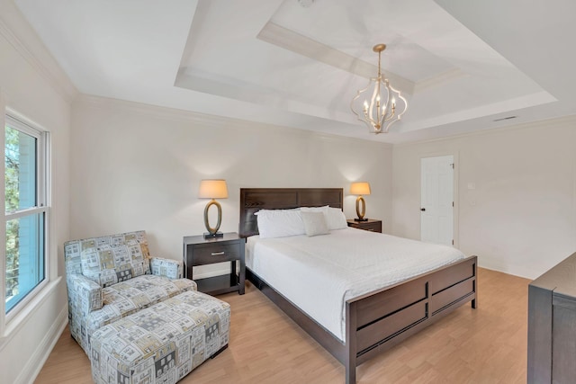 1237 Temple Ridge Dr, Nashville, TN 37221 - bedroom with light wood-type flooring, a chandelier, and a raised ceiling