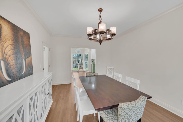 1237 Temple Ridge Dr, Nashville, TN 37221 - dining space with baseboards, a chandelier, light wood-style floors, and crown molding