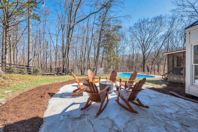 1237 Temple Ridge Dr, Nashville, TN 37221 - view of patio / terrace with a view of trees, a sunroom, fence, and an outdoor pool