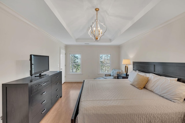 1237 Temple Ridge Dr, Nashville, TN 37221 - bedroom with crown molding, an inviting chandelier, light wood-type flooring, and a raised ceiling