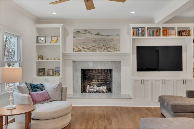 1237 Temple Ridge Dr, Nashville, TN 37221 - living area with recessed lighting, built in shelves, a ceiling fan, a fireplace, and wood finished floors