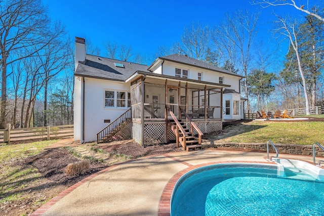 1237 Temple Ridge Dr, Nashville, TN 37221 - back of house featuring a sunroom, fence, stairs, brick siding, and a chimney