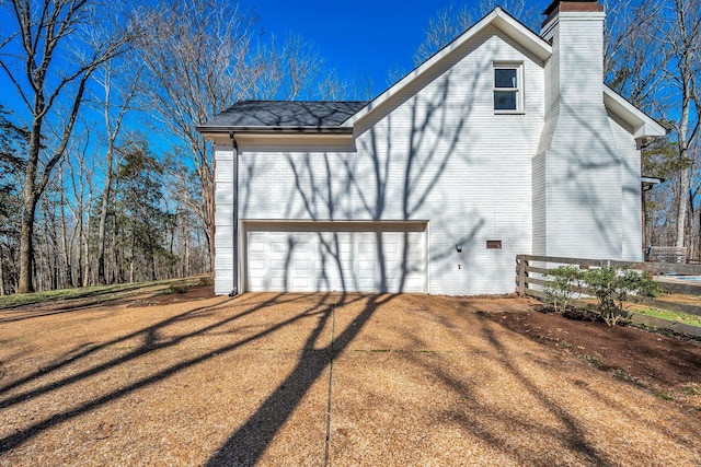 1237 Temple Ridge Dr, Nashville, TN 37221 - view of side of property with a chimney and a garage