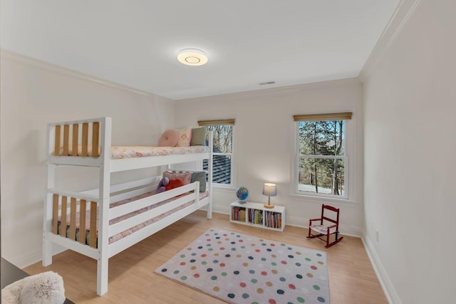 1237 Temple Ridge Dr, Nashville, TN 37221 - bedroom featuring baseboards, visible vents, wood finished floors, and crown molding