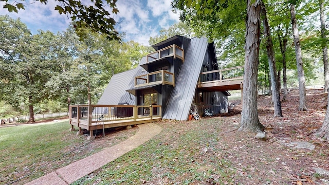 2235 Rock Springs Rd, Columbia, TN 38401 - rear view of property with a deck, fence, and metal roof