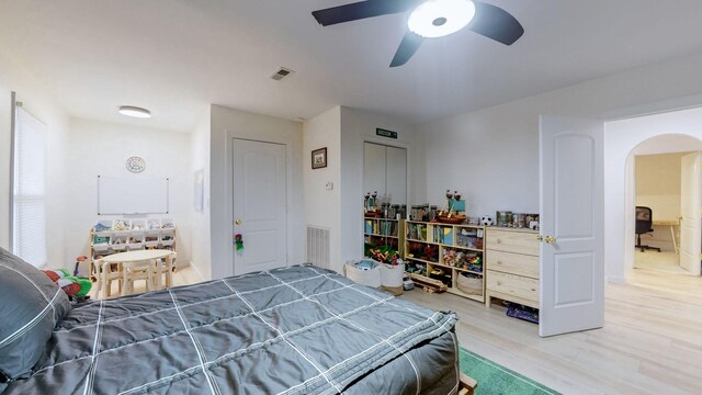 2235 Rock Springs Rd, Columbia, TN 38401 - bedroom with wood finished floors, arched walkways, ceiling fan, and visible vents