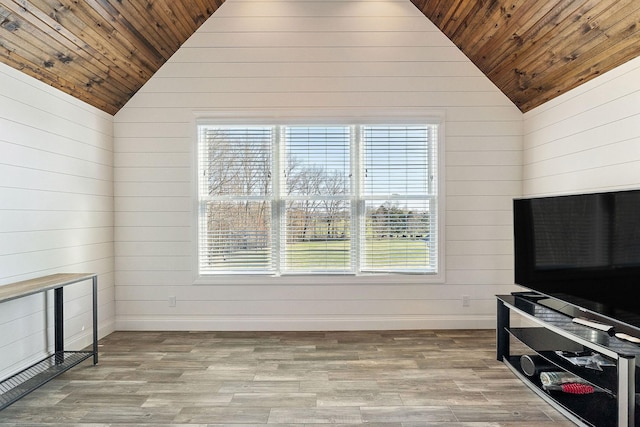 living room featuring wood ceiling, plenty of natural light, lofted ceiling, and wood finished floors