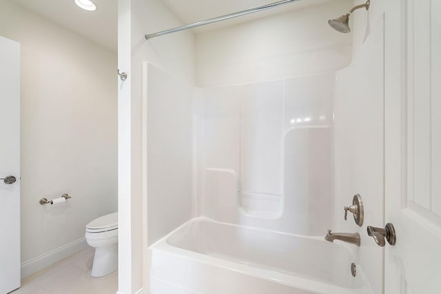 bathroom with  shower combination, baseboards, toilet, and tile patterned flooring