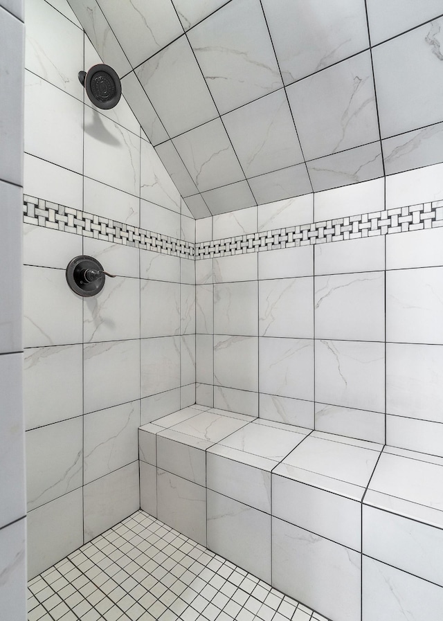 bathroom with tiled shower
