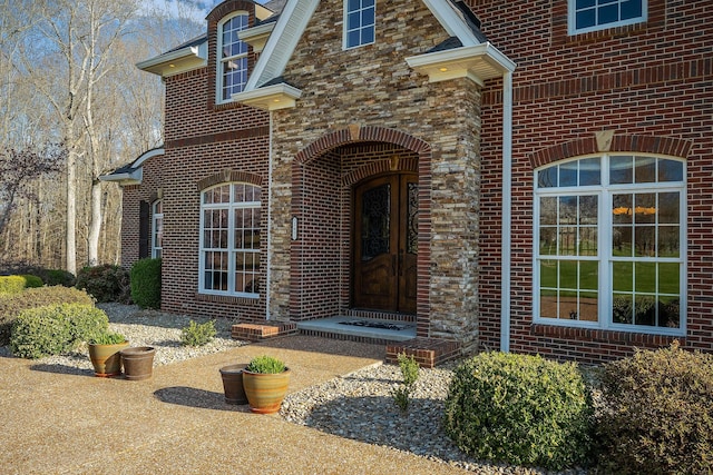 entrance to property with brick siding