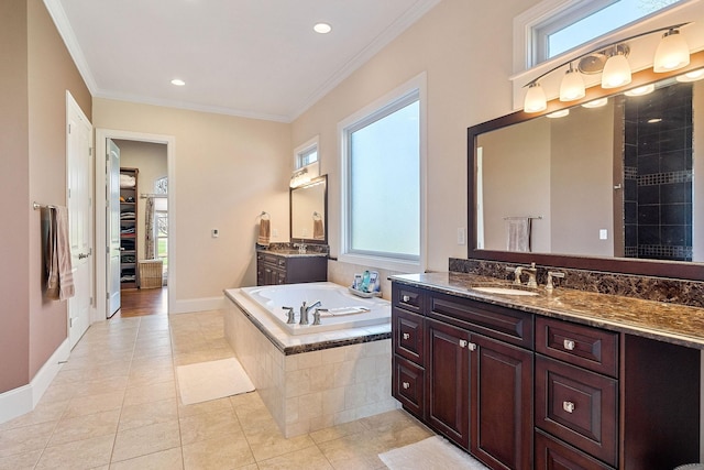 bathroom with crown molding, tile patterned floors, a sink, two vanities, and a bath