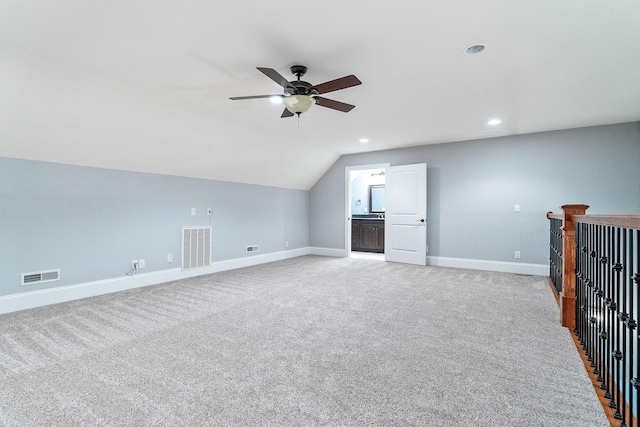 bonus room with baseboards, lofted ceiling, ceiling fan, and visible vents