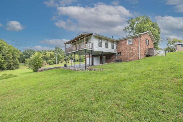 back of house featuring brick siding, central AC, and a lawn