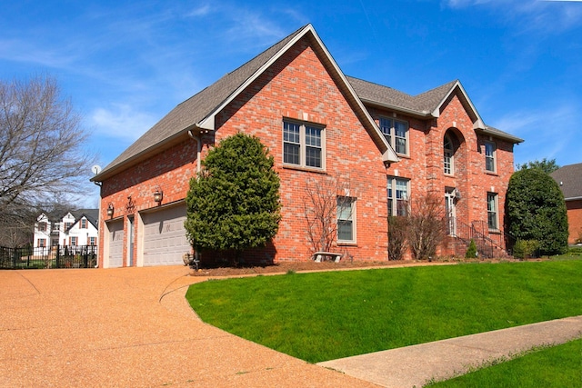 1005 Willow Park Cir, Hendersonville, TN 37075 - view of side of property featuring brick siding, concrete driveway, a garage, and a shingled roof