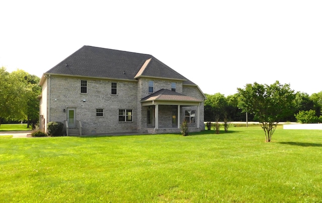 423 Carters Creek Pike, Columbia, TN 38401 - rear view of house featuring a yard, brick siding, and crawl space