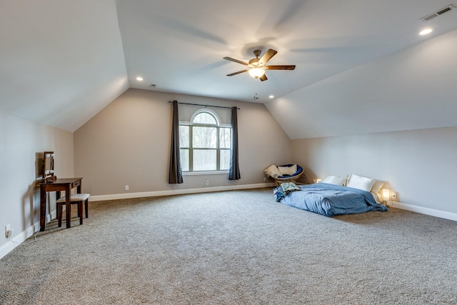carpeted bedroom with baseboards, ceiling fan, visible vents, and vaulted ceiling