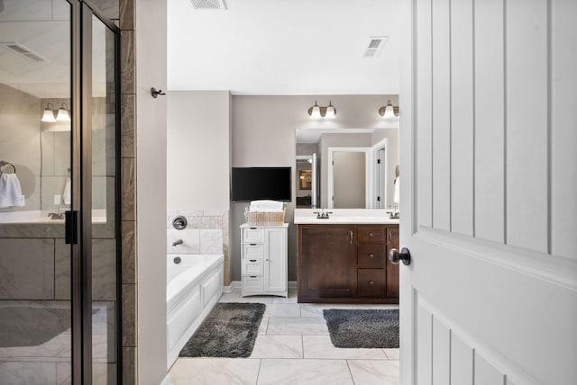 full bathroom with visible vents, vanity, and a shower stall