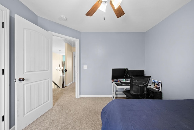 bedroom featuring baseboards, ceiling fan, and carpet flooring