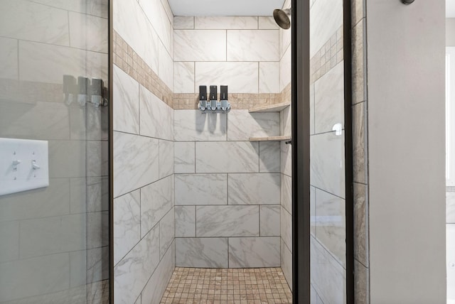 full bath featuring a shower stall