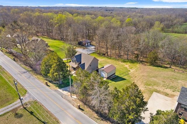birds eye view of property with a wooded view