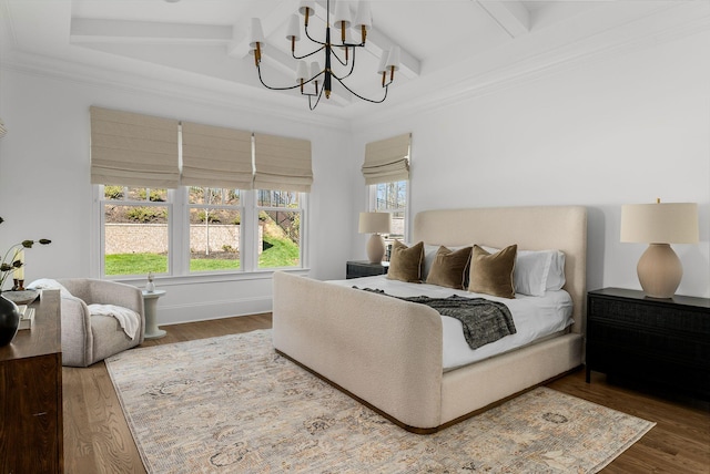 bedroom with crown molding, wood finished floors, a chandelier, and beamed ceiling