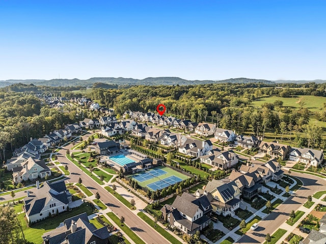 drone / aerial view featuring a residential view and a mountain view