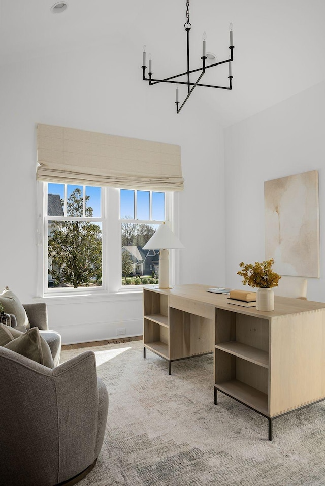 office area featuring an inviting chandelier and carpet