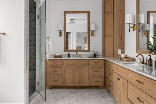 bathroom featuring a stall shower, marble finish floor, and vanity