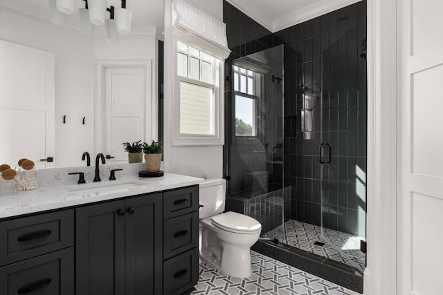 full bath with vanity, ornamental molding, toilet, and a shower stall