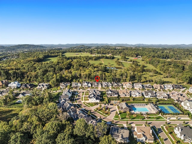 birds eye view of property featuring a residential view and a view of trees