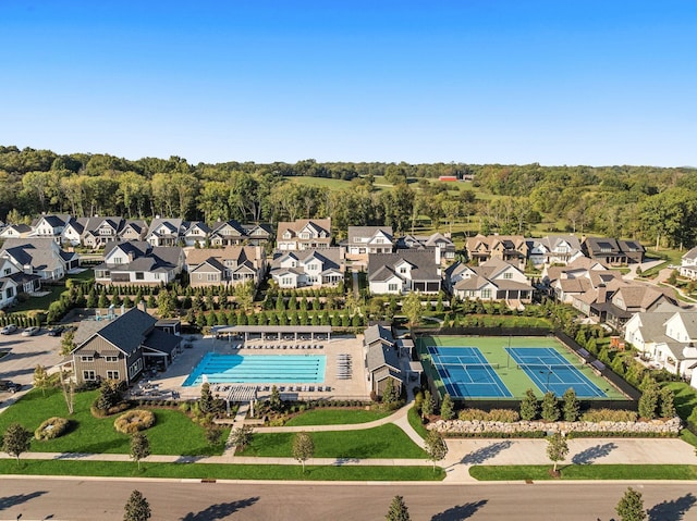 birds eye view of property featuring a residential view and a view of trees