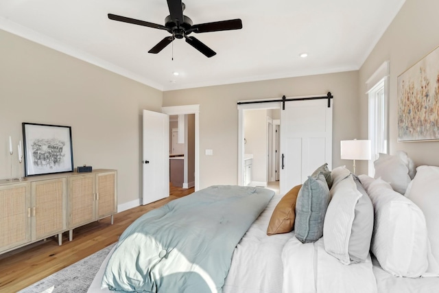 6477 Simmons Acres Ln, Lascassas, TN 37085 - bedroom with a barn door, wood finished floors, connected bathroom, recessed lighting, and a ceiling fan