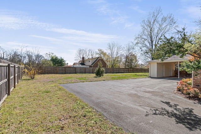 518 Wilson Pike, Brentwood, TN 37027 - view of yard featuring a carport, driveway, and fence private yard