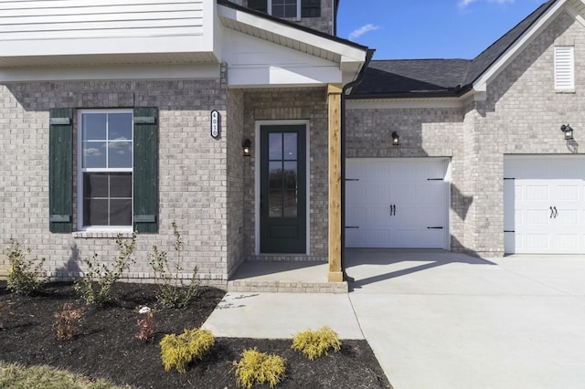 166 Oasis Dr, La Vergne, TN 37086 - entrance to property featuring an attached garage, brick siding, and concrete driveway