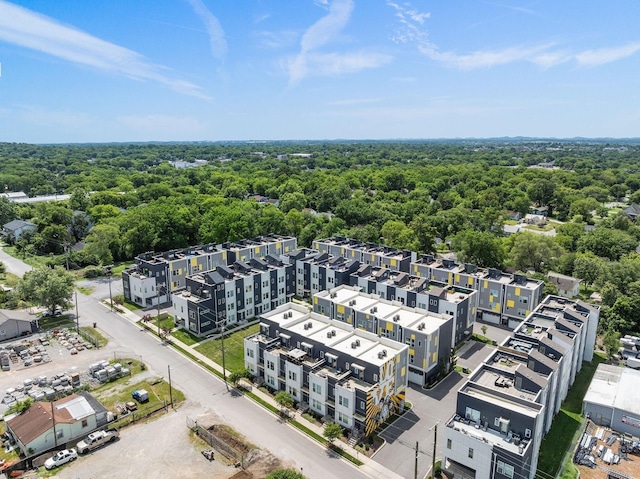 drone / aerial view featuring a view of trees