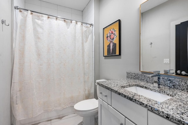 bathroom with toilet, shower / bath combo, and vanity
