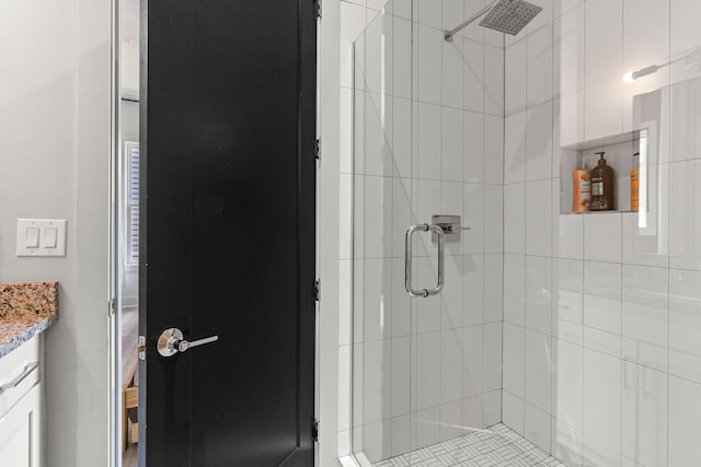 full bath featuring vanity and a stall shower