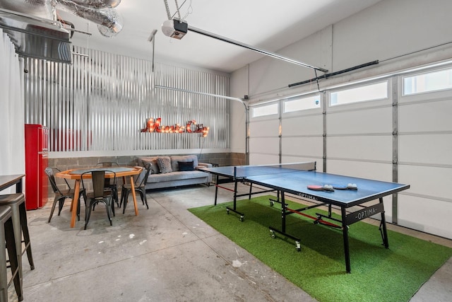recreation room featuring concrete flooring