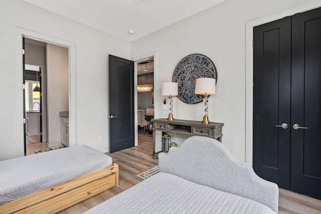 bedroom with light wood finished floors