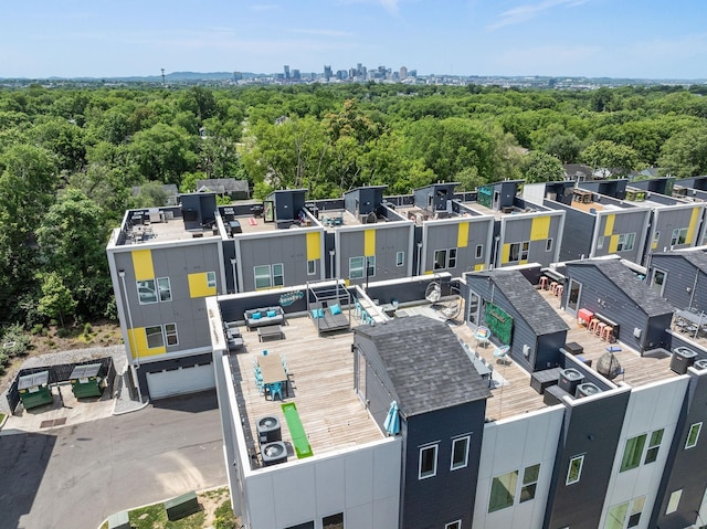 birds eye view of property with a forest view