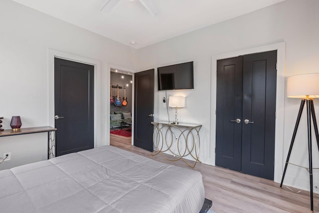 bedroom featuring a closet, ceiling fan, and wood finished floors