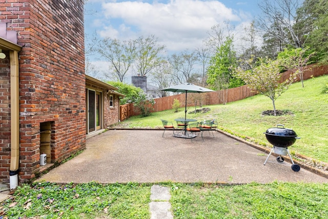 view of patio with a fenced backyard and area for grilling