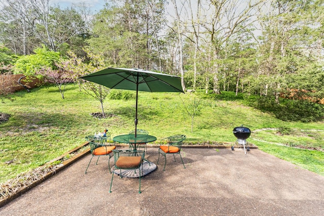 view of patio / terrace with a grill and outdoor dining area