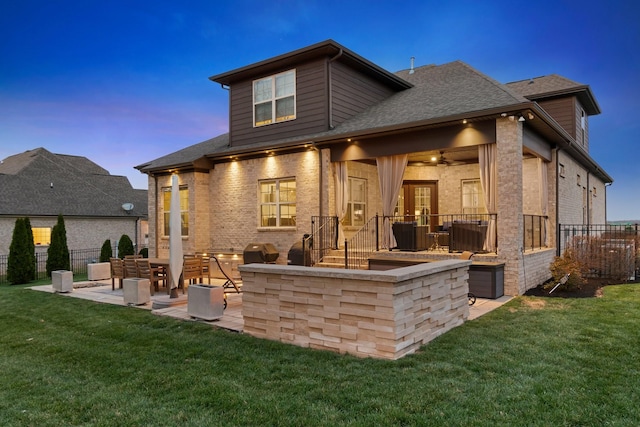 118 Newnham Bridge Dr, Nolensville, TN 37135 - back of property at dusk featuring a yard, fence, a patio area, and a shingled roof